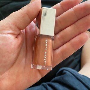 Fenty Beauty mini lipgloss in the shade Fenty Glow